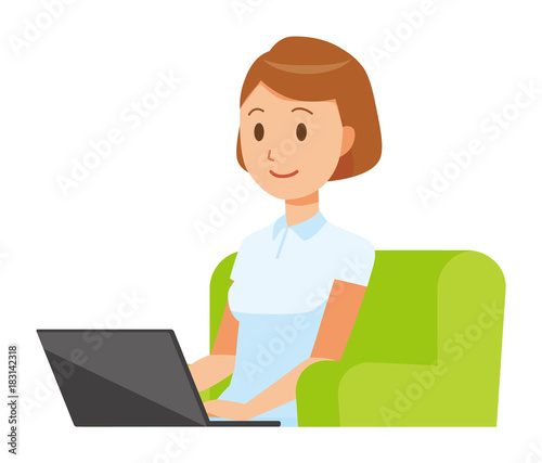 A woman nurse wearing a white uniform is sitting on the sofa and operating a laptop computer