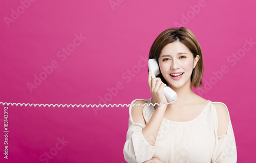 Young Beautiful Woman Talking On the Phone.