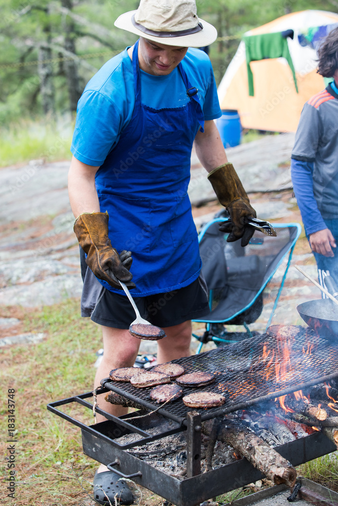 Cooking over an open fire on a camping trip