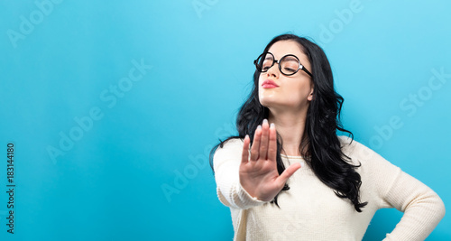 Fotografi Young woman making a rejection pose a solid background