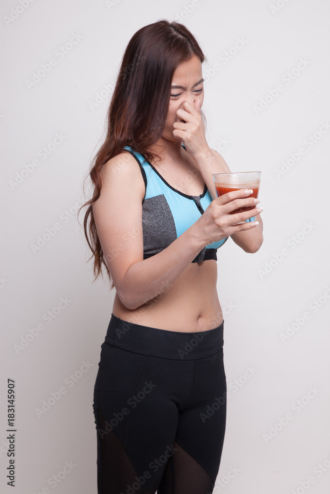 Beautiful healthy Asian girl hate tomato juice. Beautiful healthy Asian girl hate tomato juice.