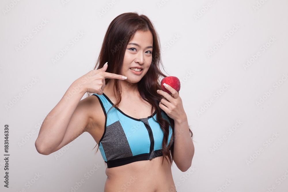 Beautiful Asian healthy girl point to apple. Beautiful Asian healthy girl point to apple.