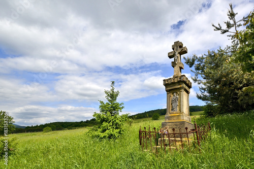 Old stone cross in forest of Low Beskid, Poland