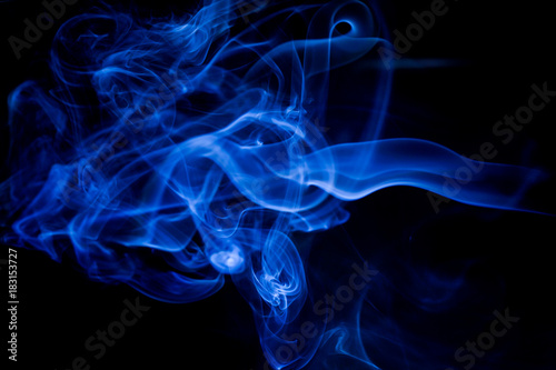 Blue toxic fumes movement on a black background.