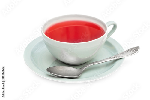 Cup of tea with tea spoon on white background.