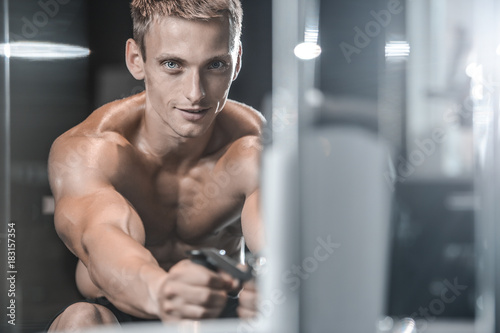 Handsome model young man training back in gym © antondotsenko