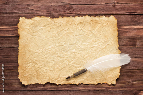 White feather and old paper...