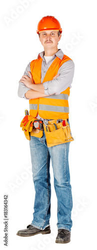 engineer in a helmet with crossed arms