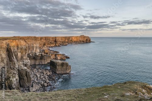 Stunning vibrant landscape image of cliffs around St Govan's Head on Pembrokeshire Coast in Wales
