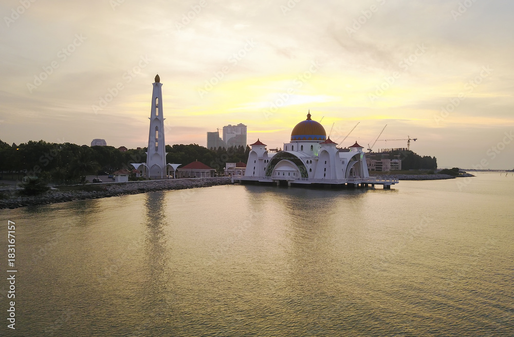 Aerial view of Majestic Malacca Straits Mosque during sunrise.