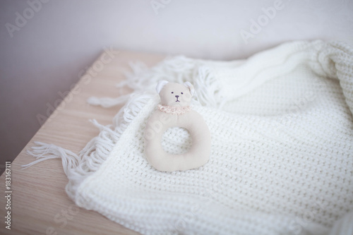 Soft rattle is handmade on white background