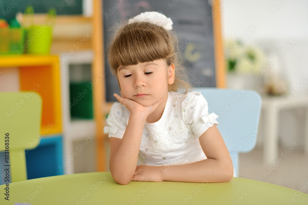 Little girl is sleeping in class Little girl is sleeping in class