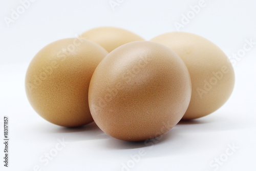Close-up view of organic Brown Eggs on Plastic Egg Carton isolated on white background