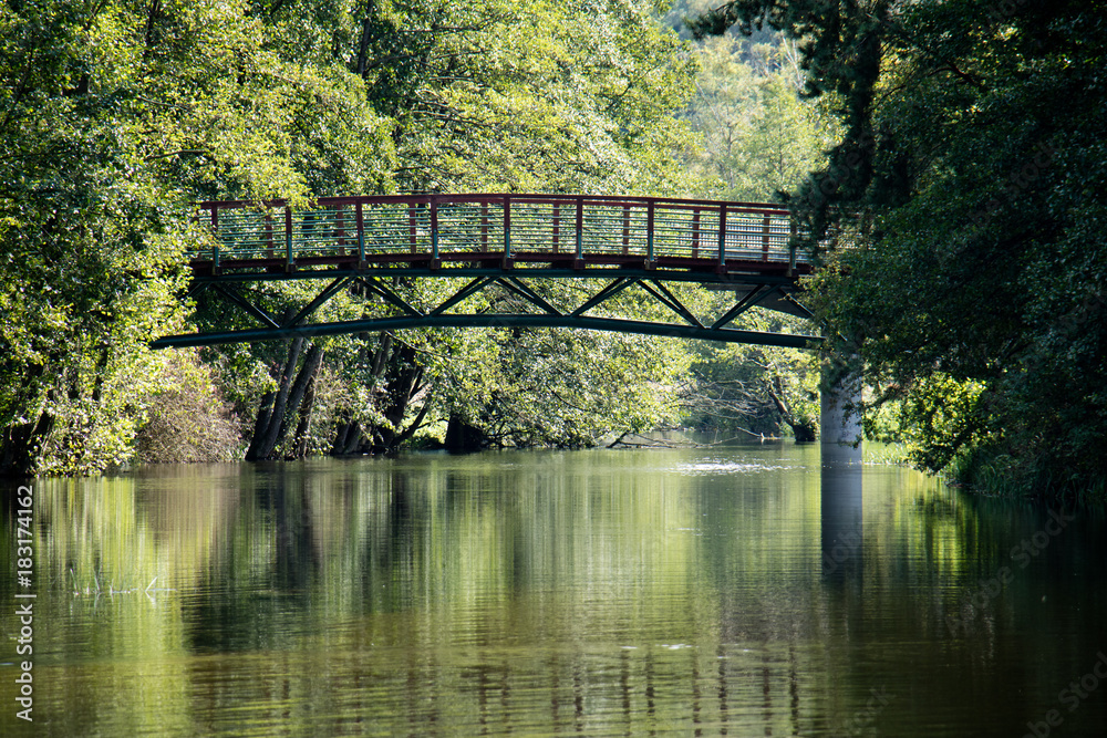 Bridge over the lake, river. Beautiful autumn season.