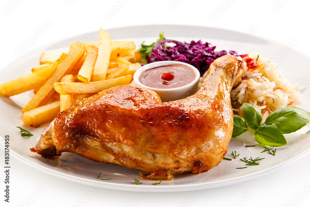     Roast chicken legs with chips and vegetables 