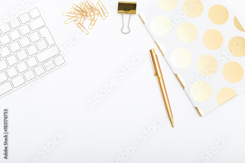 Workplace with golden objects. Copy space