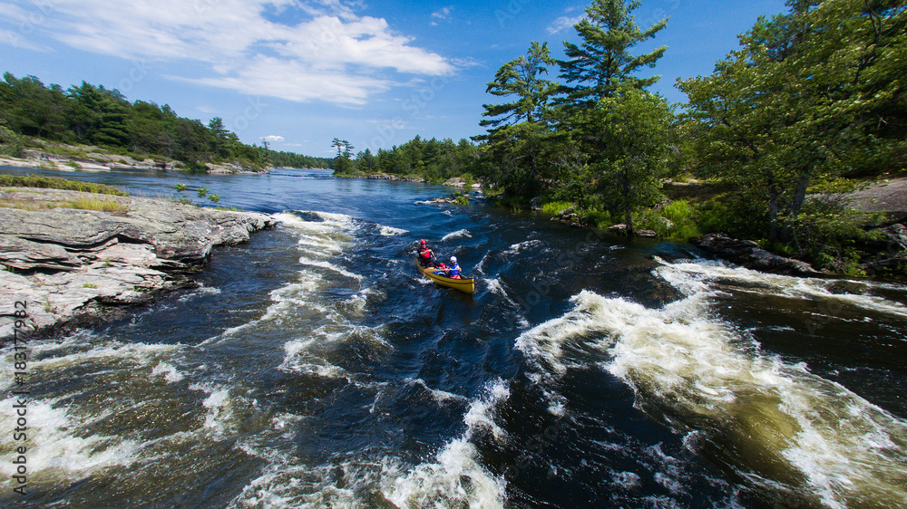Aerial photo of a family whitewater canoe trip