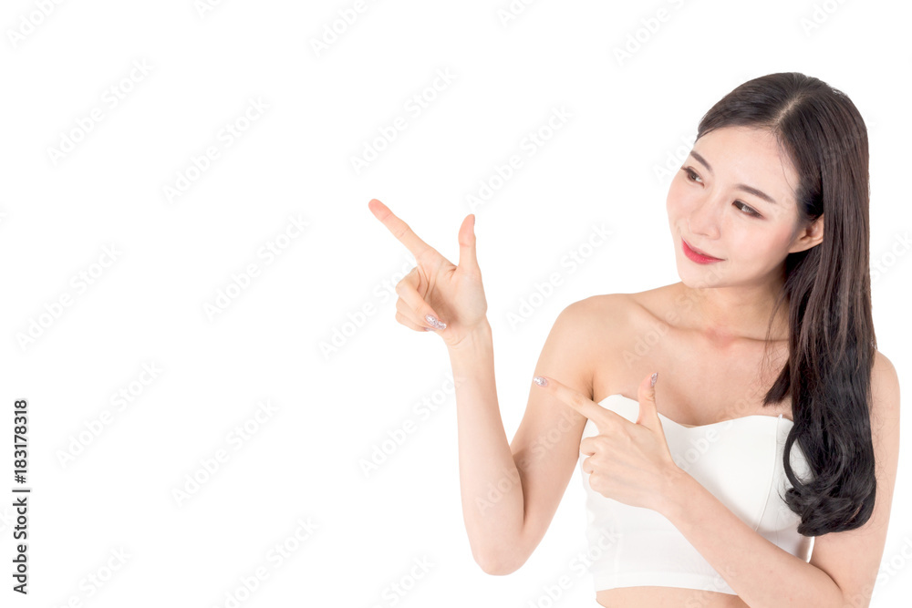 Beautiful young woman pointing with copy space for product isolated on white background Beautiful young woman pointing with copy space for product isolated on white background