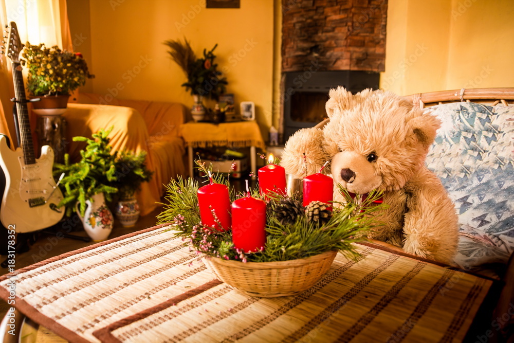 Teddy bear Dranik lights up christmas candle