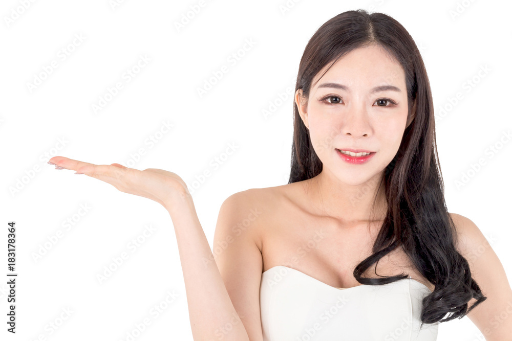 Beautiful young woman showing open hand palm presenting with copy space for product isolated on white background Beautiful young woman showing open hand palm presenting with copy space for product isolated on white background