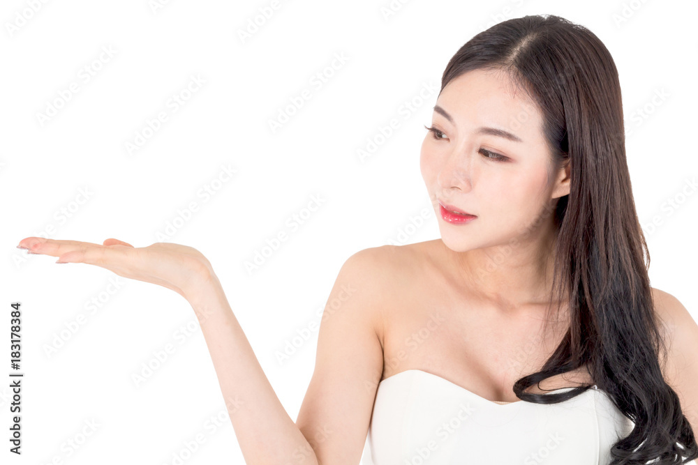 Beautiful young woman showing open hand palm presenting with copy space for product isolated on white background Beautiful young woman showing open hand palm presenting with copy space for product isolated on white background