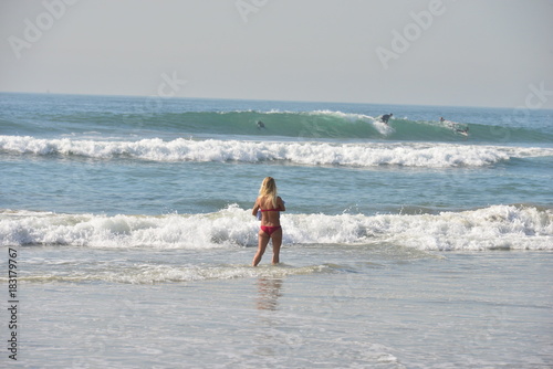 A girl by the sea at Huntington beach in California