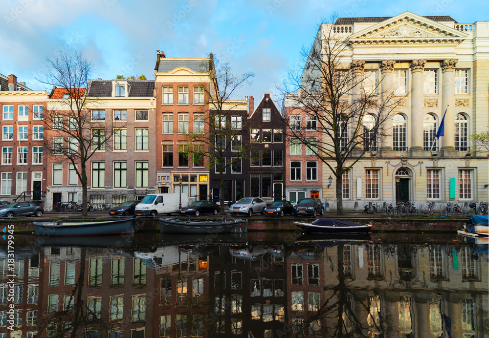 Obraz premium Facades of historic dutch houses over canal with mirror reflections, Amstardam, Netherlands, retro toned