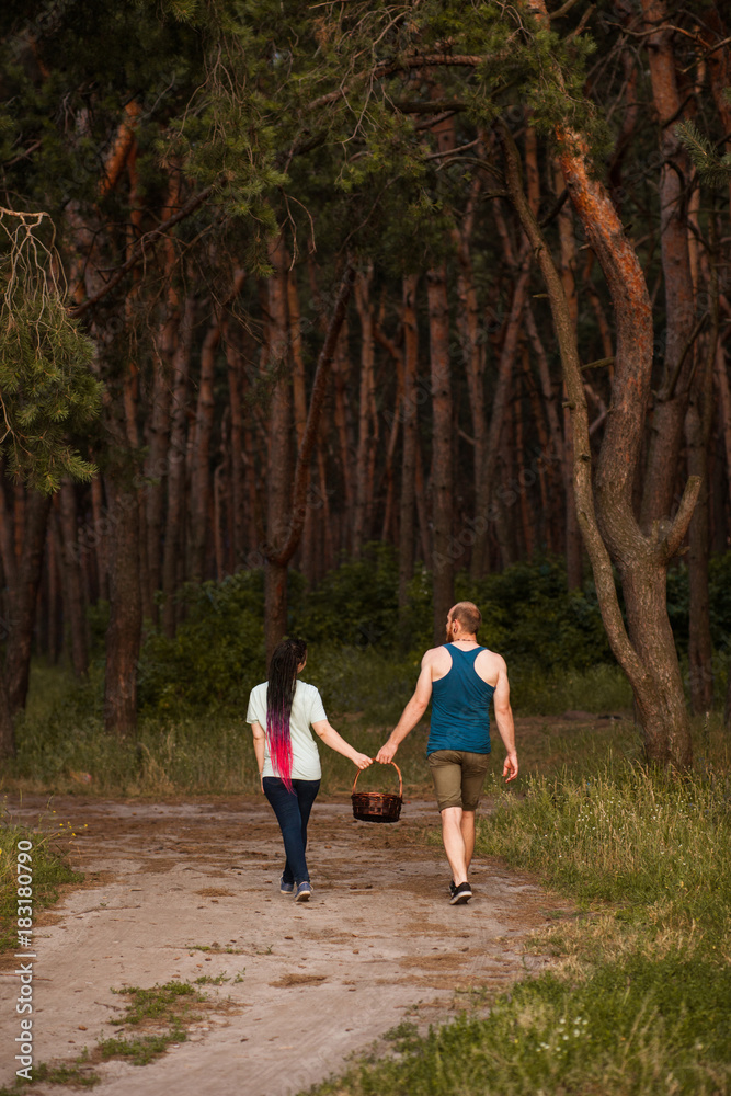 Couple walk forest picnic love concept. Hiker lifestyle. Together on the nature.