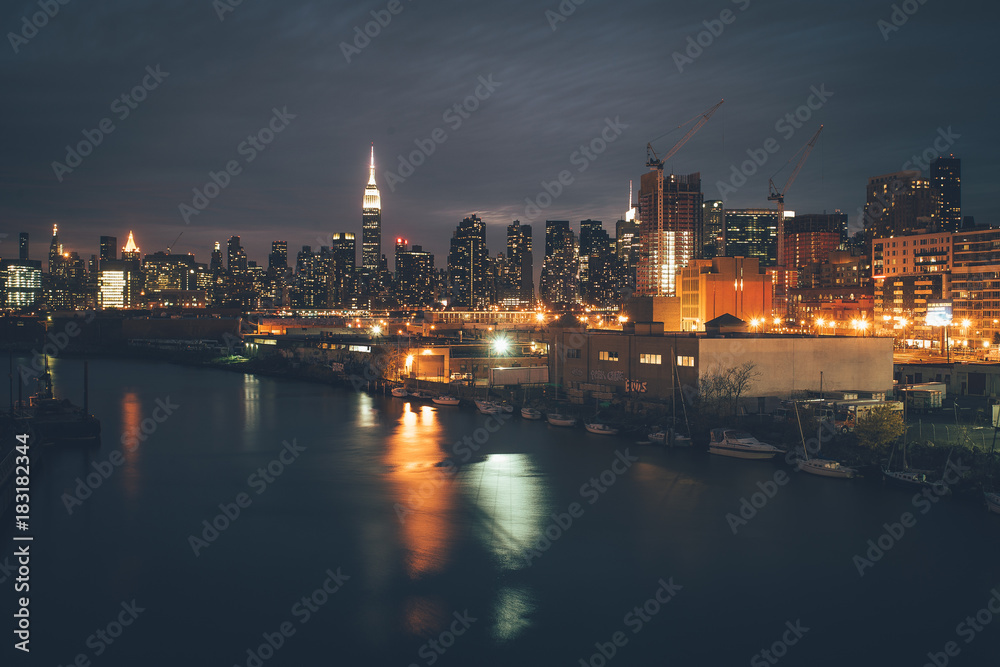 night landscape of New York Manhattan reflected in water industrial landscape