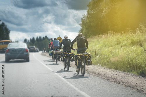 bicycle travelers on the road under the sun © Mak