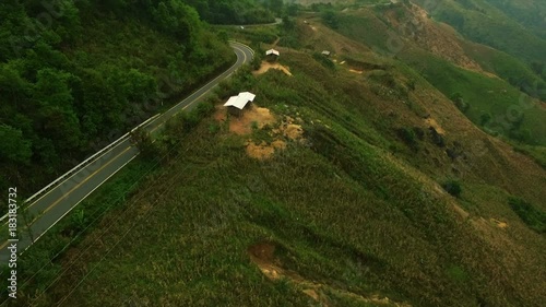 Aerial view of countryside road surrounded by the beautiful Doi Phuka mountain forrest in Nan Province Northern Thailand photo