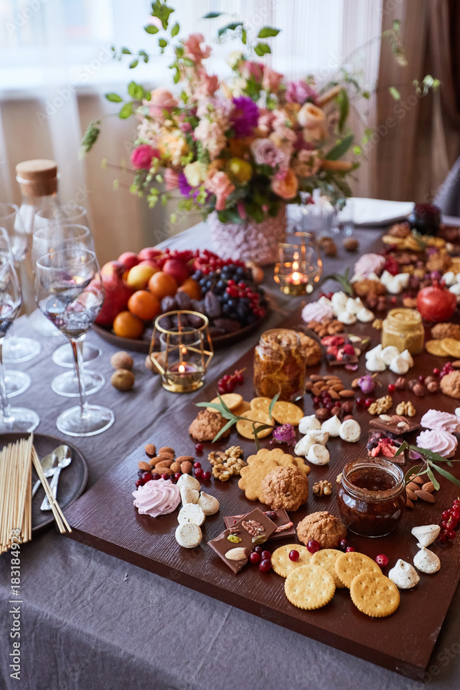 Delicious sweets on candy buffet. different sweets on a wooden table