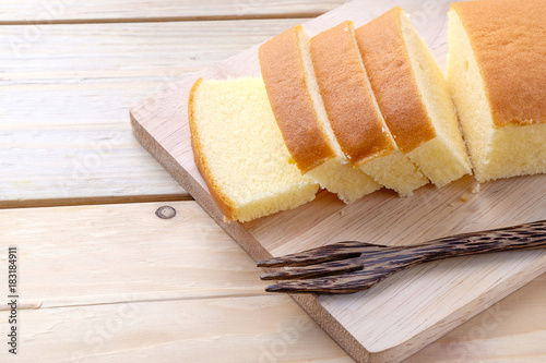 Butter cake on wooden background