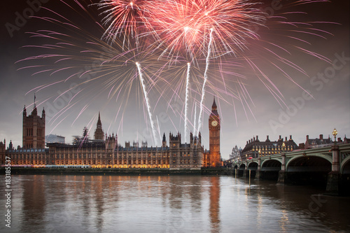 explosive fireworks display fills the sky around Big Ben. New Year s Eve celebration in the city