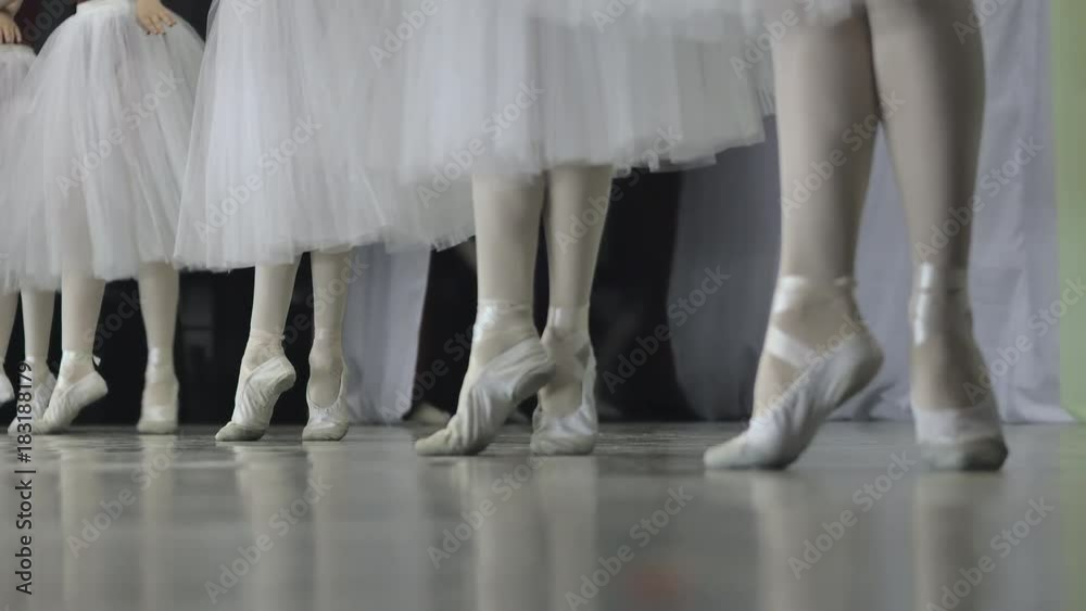 Ballet.Close-up of a girl's legs in white ballet shoes during ballet training. Element of classical dance. 4K Ballet.Close-up of a girl's legs in white ballet shoes during ballet training. Element of classical dance. 4K