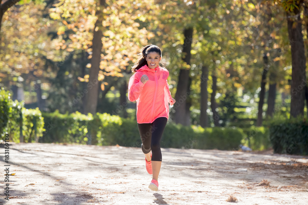 attractive and happy runner woman in Autumn sportswear running a attractive and happy runner woman in Autumn sportswear running a