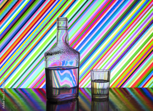 half a bottle of vodka and glasses