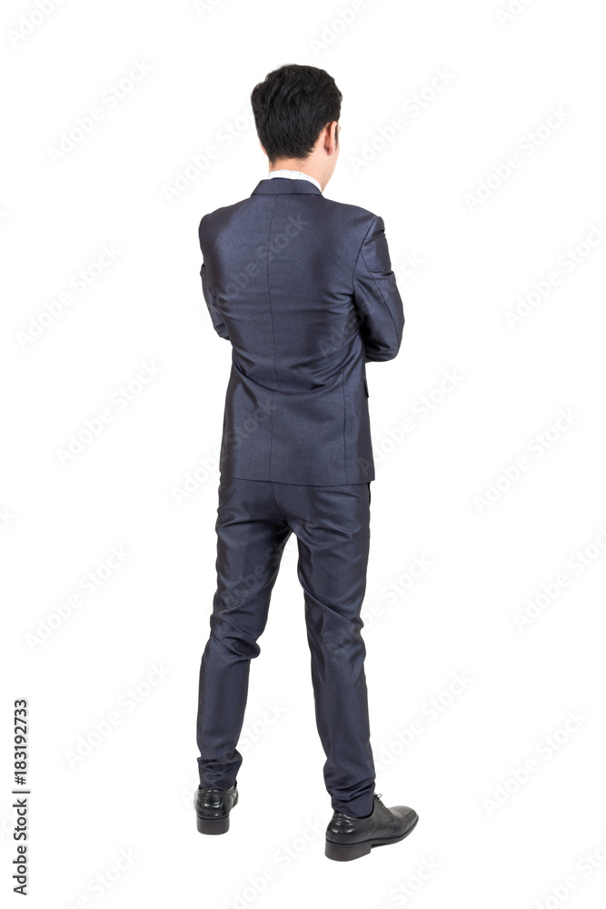 Businessman in black suit standing isolated on white background Businessman in black suit standing isolated on white background