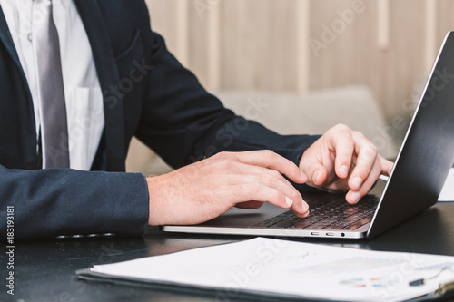 Businessman working with laptop computer at the office © Art_Photo