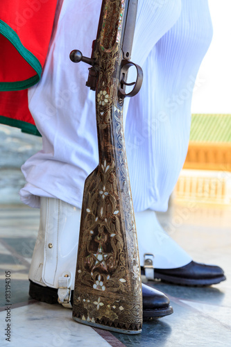 Beautiful rifle with mosaic of a guard at the Mausoleum of Mohammed V in Rabat photo