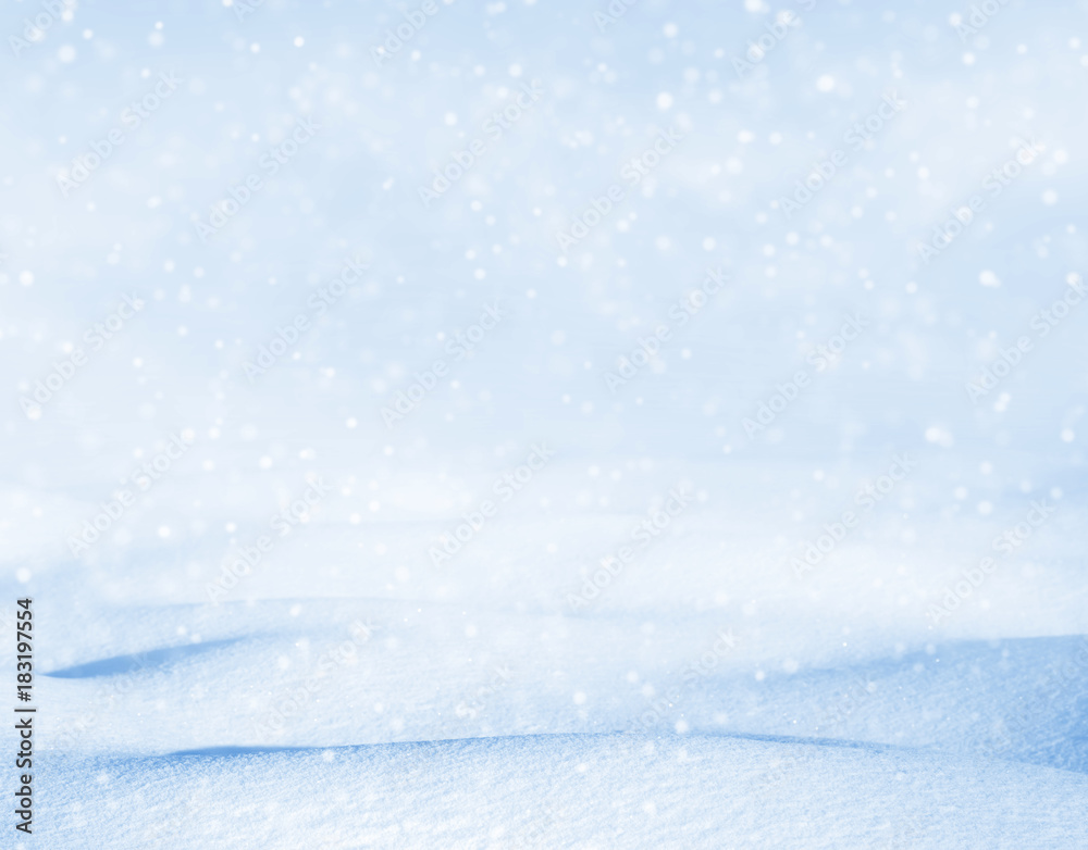 Winter background. Winter bright landscape with snowdrifts and falling snow.