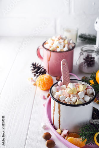 two cups with hot chocolate or cocoa with melted marshmallow