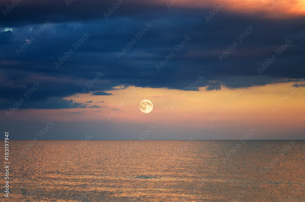 storm cloud over the sea. sunset. moon rise. storm cloud over the sea. sunset. moon rise.
