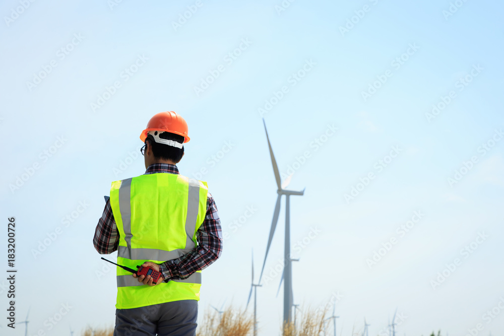 Engineers are investigating the wind turbine. Engineers are investigating the wind turbine.