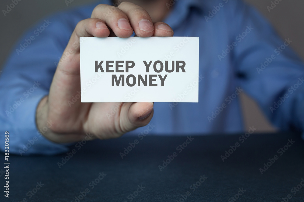 Hand showing business card with a keep your money word. Hand showing business card with a keep your money word.