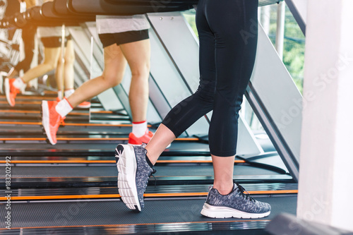 People running on machine treadmill at fitness gym.fitness and lifestyle concept