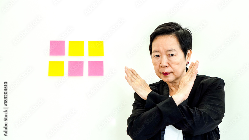 Asian business senior woman unhappy expression with copy space note paper Asian business senior woman unhappy expression with copy space note paper