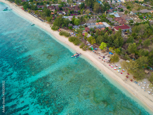 Fototapeta Naklejka Na Ścianę i Meble -  Aerial view of Gili Trawangan Island coastline with boats and buildings, West Nusa Tenggara, Indonesia