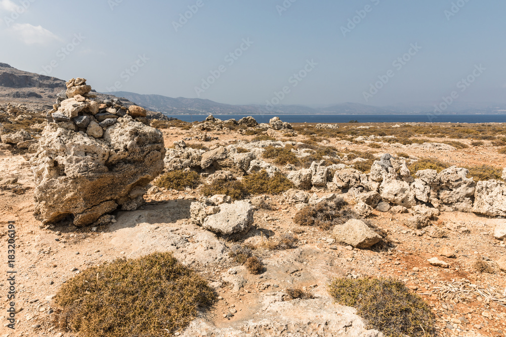 Stony landscape on the way to the Kleoboulous's tomb in Lindos on the Rhodes Island, Greece. Stony landscape on the way to the Kleoboulous's tomb in Lindos on the Rhodes Island, Greece.
