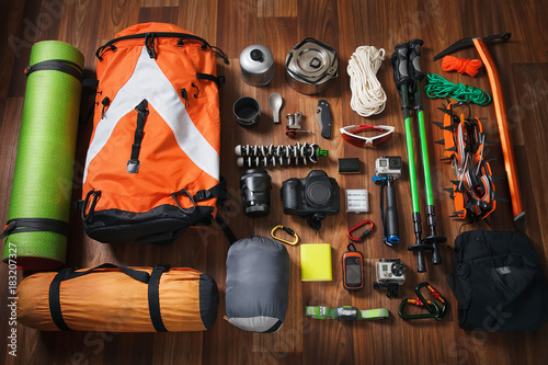 Wallpaper Mural climbing equipment: rope, trekking shoes, crampons, ice tools, ice ax, ice screws, set on dark wooden background, top view. Torontodigital.ca